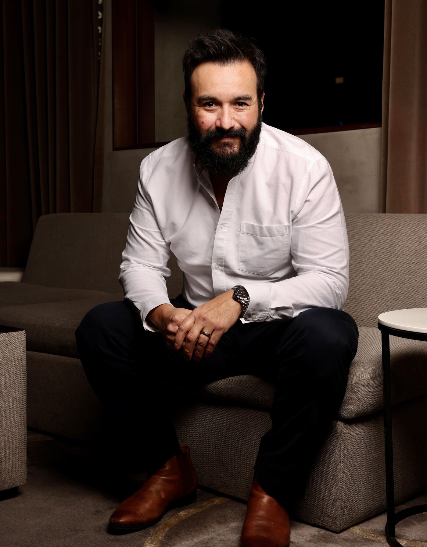 Fashion show host portrait in a white shirt